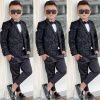 Black paisley boys' five-piece tuxedo set, modelled