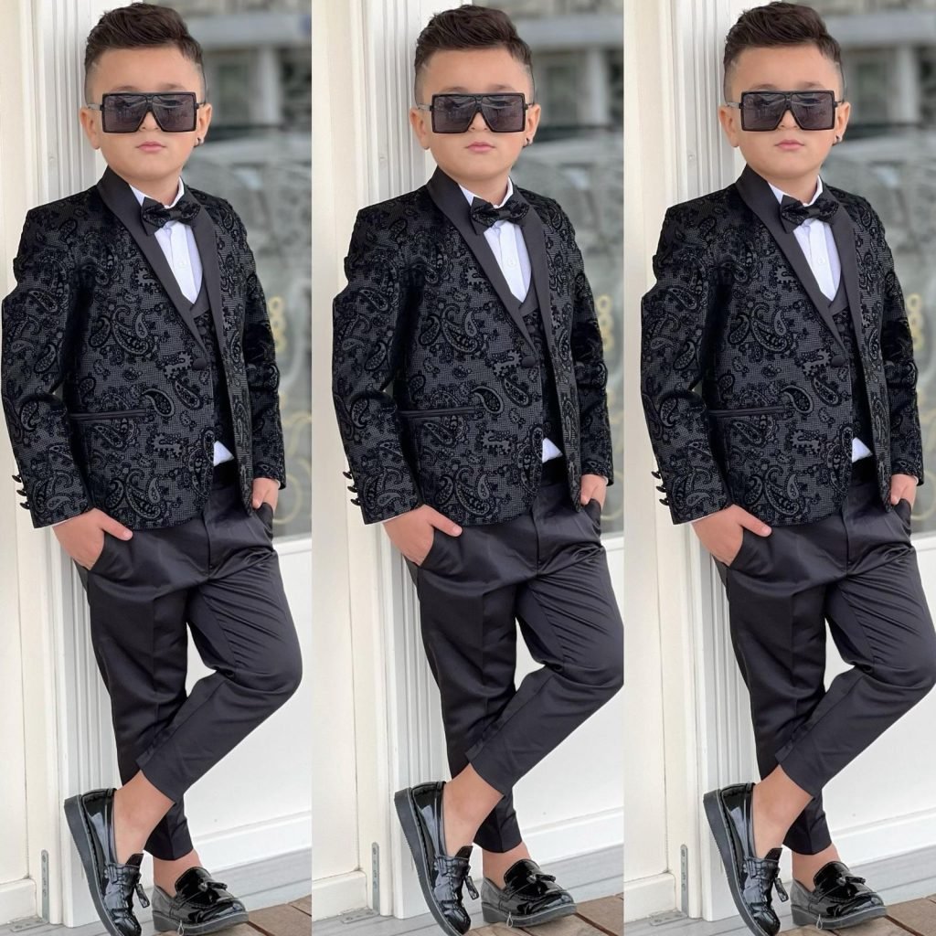 Black paisley boys' five-piece tuxedo set, modelled