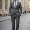 Men's dark grey three-piece 100% wool slim-fit suit with a two-button jacket, waistcoat and trousers